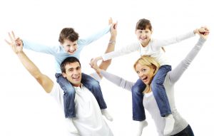 Parents giving children piggyback ride. Isolated on a white background.